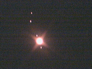 Jupiter and its four moons discovered by Galileo.jpg